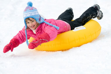Young-girl-snow-tubing-380x252.jpg