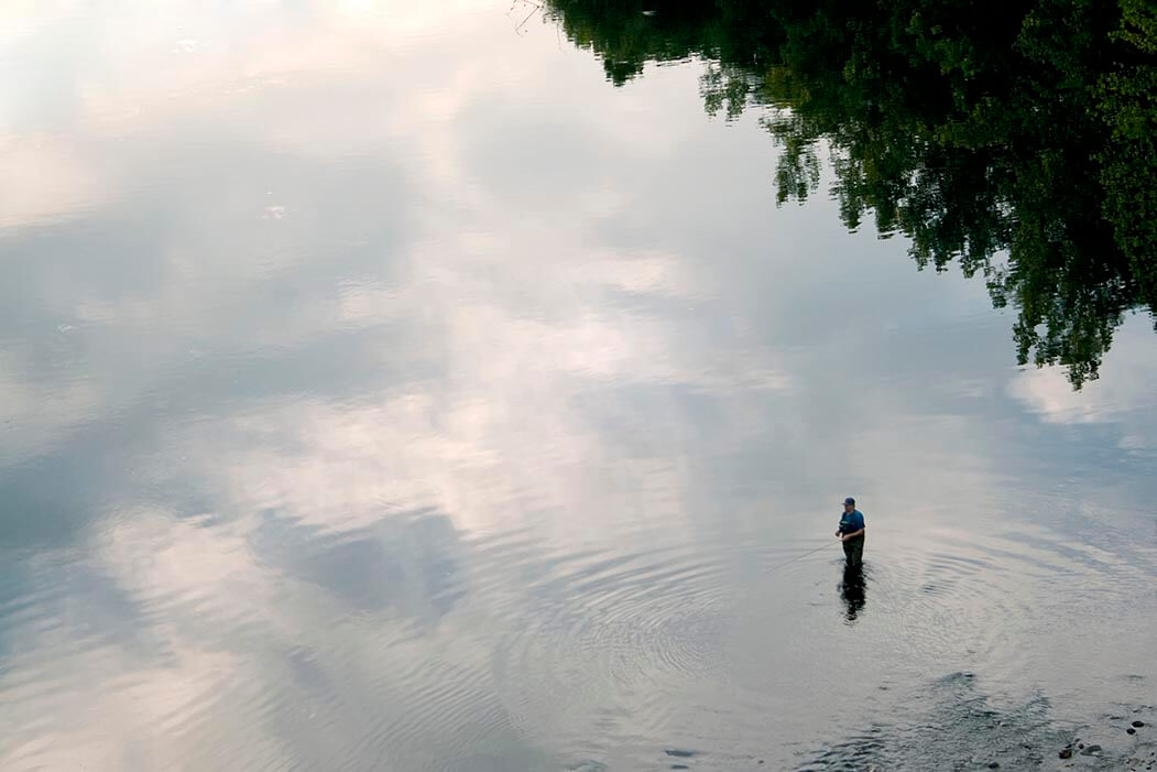 a-patient-fly-fisherman-enjoying-a-section-of-the-farmington-river-found-in-connecticut_rF8mhvRBi.jpg